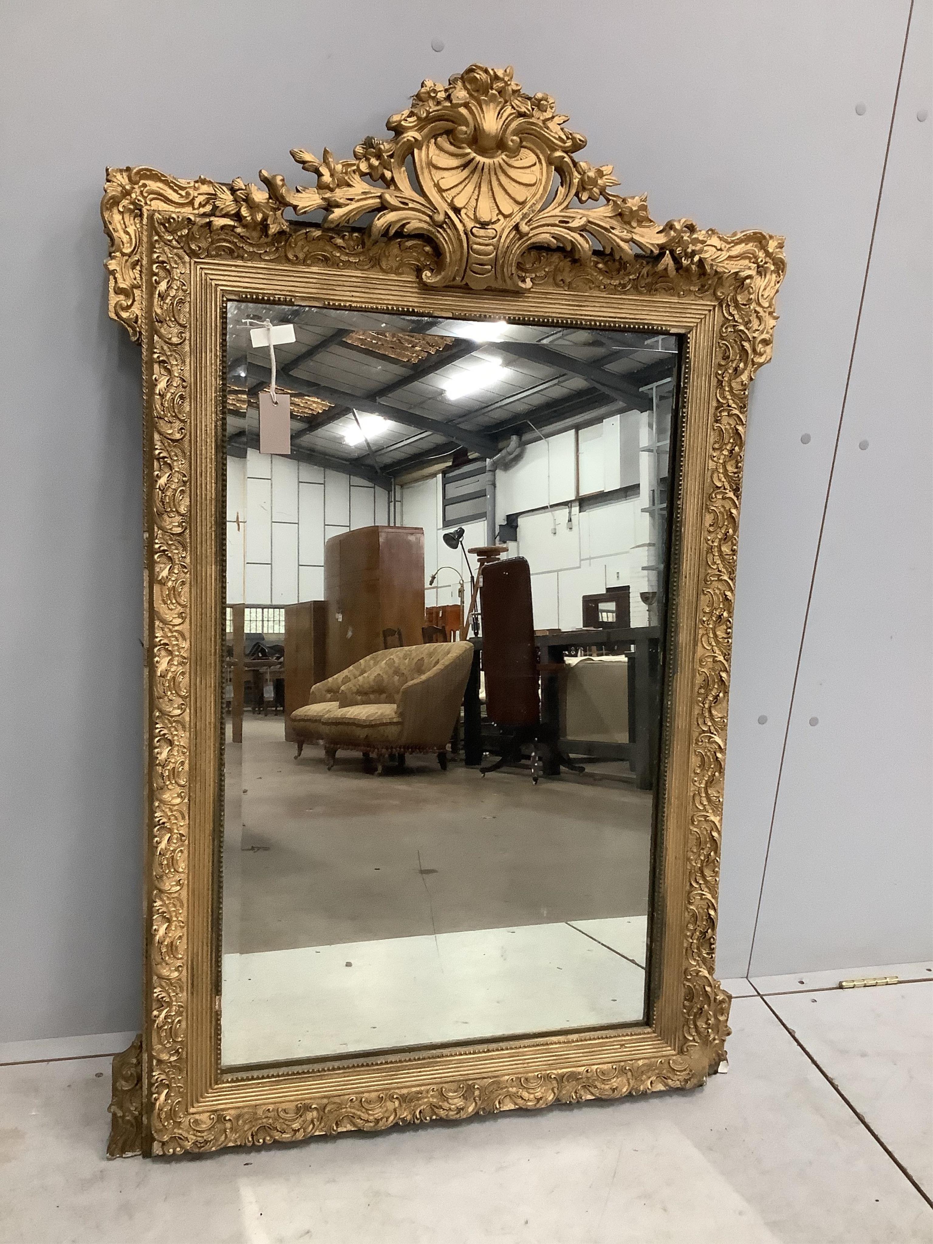 A 19th century French giltwood and composition wall mirror, width 84cm, height 131cm. Condition - poor to fair